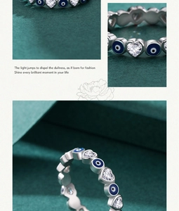 Macro shot of S925 sterling silver ring with blue evil eye and heart cubic zirconia