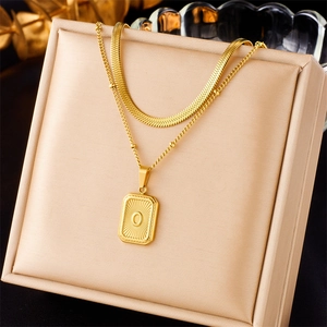 Double-layered gold necklace with flat snake chain and letter O rectangle pendant