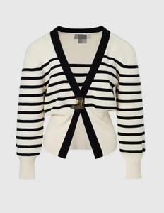 Detail of V-neck striped knit cardigan featuring elegant gold metal buckles and trim