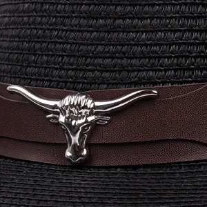 Detail of black straw fedora with brown leather band and silver bull skull ornament