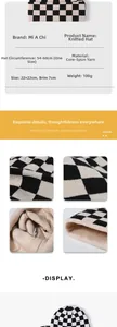 Detail view of checkered knit hat showing 22x22cm dimensions and core-spun yarn material