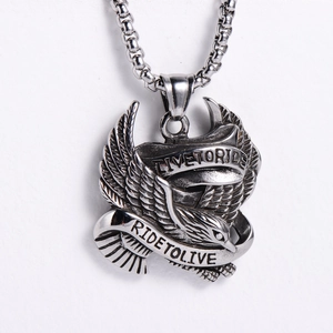 Close-up of eagle pendant with Live to Ride engraving and vintage silver texture