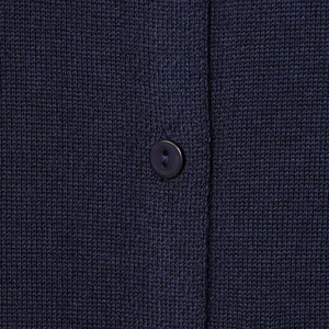 Detail of navy blue knit cardigan featuring fine texture and round four-hole button closure