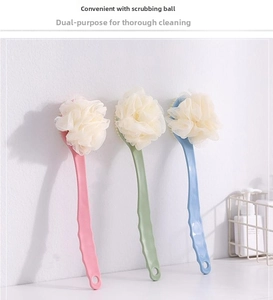 Detailed view of three long-handled bath brushes in pink, green, and blue with soft loofah mesh