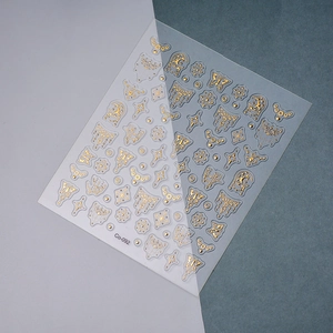 Detailed view of Co-092 gold foil butterfly nail decals with 5D embossed butterfly patterns