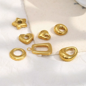 Detailed view of assorted 18K gold plated stainless steel geometric DIY charms