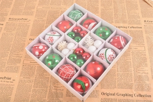 Close-up of 42 red and green Christmas ornaments in a grid box with vintage background