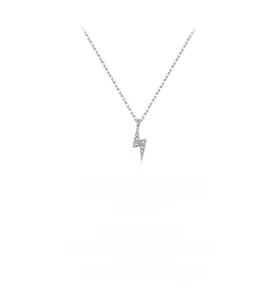 Macro detail of silver lightning bolt pendant encrusted with sparkling micro crystals