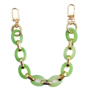 Retro green acrylic oval link handbag chain with gold lobster clasps on white background
