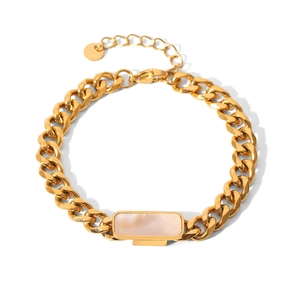 Detailed shot of golden Cuban chain bracelet with a rectangular pink mother-of-pearl inlay
