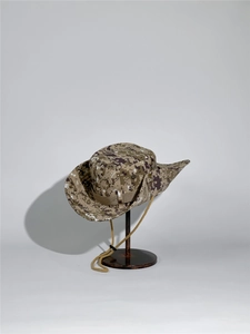 Detail of desert digital camo boonie hat with tactical web loops and adjustable chin cord