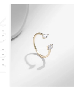 Macro detail of S925 sterling silver gold ring with marquise and rectangular stones