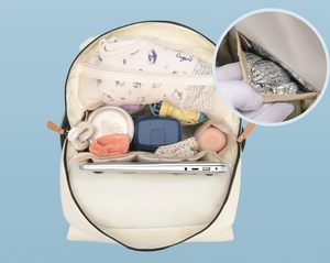 Top view of cream diaper bag with spacious compartments and foil insulation layer
