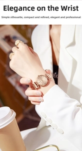Close-up of rose gold quartz watch on female wrist showing slim metal strap and minimal dial