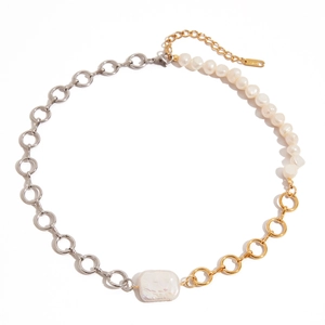 Asymmetrical necklace with silver and gold links featuring freshwater and baroque pearls