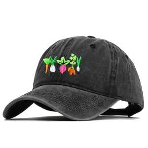 Close-up of colorful vegetable embroidery on washed black cotton vintage baseball cap