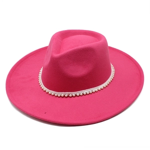 Detailed top view of magenta wool fedora hat with elegant white pearl band decoration