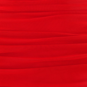 Macro shot of red mesh fabric showing detailed texture and soft pleated ruching on dress