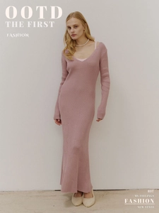 Detail of elegant V-neck slim fit knitted long dress in soft purple with ribbed texture