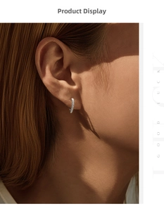 Close-up of S925 sterling silver heart hoop earrings with pavé set moissanite on ear