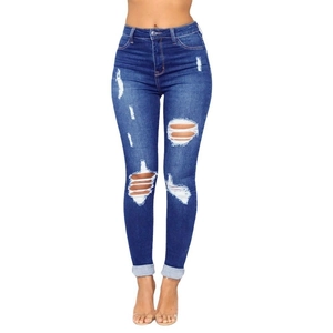 Slim fit high waisted ripped blue jeans for women with rolled cuffs and distressed denim
