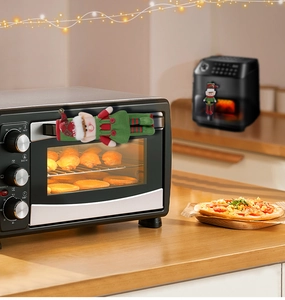 Christmas elf handle covers on kitchen oven and air fryer with festive decorations