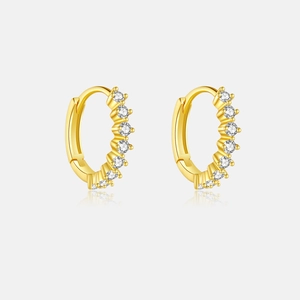 Detail of gold-plated hoop earrings featuring multiple clear round zircon stones