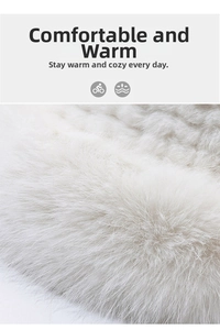 Detail view of the soft cream faux fur texture and dense plush fibers of this winter hat