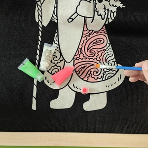 DIY Christmas glow-in-the-dark painting kit with canvas, paints, and brush for coloring