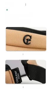 Detailed close-up of khaki sun hat featuring a metal G logo and COOLKNIT tech label