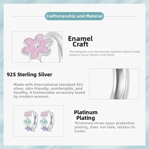 Detail view of 925 sterling silver colorful enamel flower hoop earrings with platinum plating