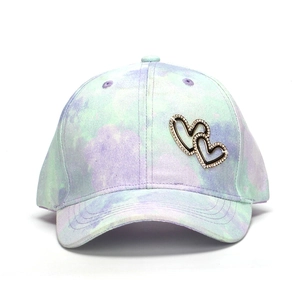 Colorful tie-dye children's baseball cap with a sparkling rhinestone heart emblem