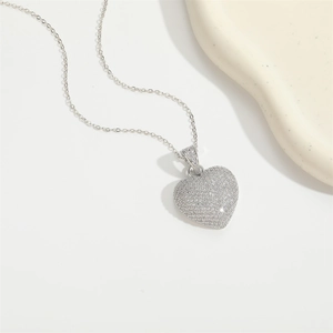 Elegant silver heart pendant necklace with shimmering pave-set white zircons for women