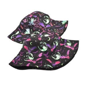 Gothic bucket hat with pink bats and green moon star patterns on black canvas