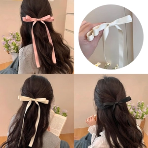 Elegant satin ribbon double bow hair clips for women in pink, beige, and black colors