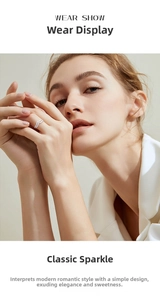 Classic double-row V-shaped silver ring with diamonds worn on the index finger