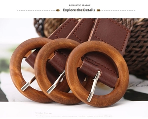 Close-up of vintage braided belt featuring large round wooden buckles and brown leather