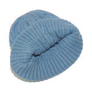 Close-up of the light blue ribbed knit texture on this warm winter beanie hat