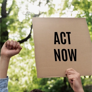 Close-up of Act Now cardboard sign used for classroom bulletin board or mailbox decoration