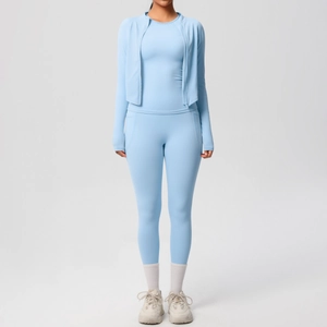 Three-piece light blue fitness set with zip jacket, long sleeve top and leggings