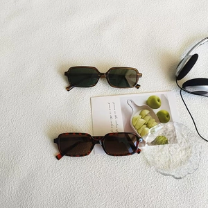 Detail shot of vintage rectangle sunglasses in tortoiseshell and leopard print frames