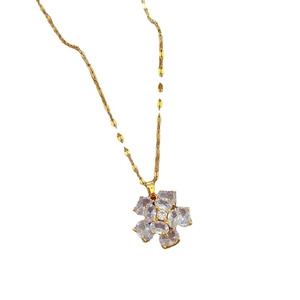 Elegant gold titanium steel necklace with a sparkling flower pendant made of zircons
