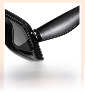 Détail des charnières robustes sur les lunettes de soleil noires pour enfants hip-hop