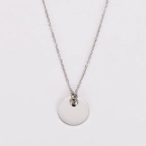 Close-up of silver stainless steel pendant with small diamond on fine link chain