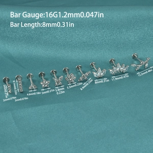 Set de 10 piercings de lèvre 16G en acier argenté avec zircons sur soie bleue