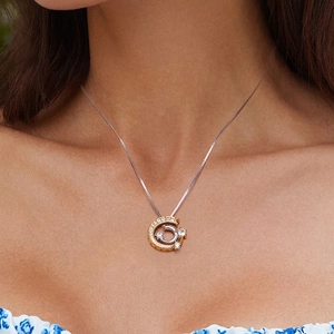 S925 sterling silver shooting star necklace with gold ring and moon pendant on model