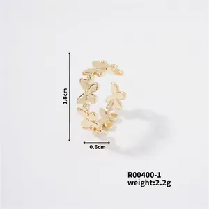 Detail view of a gold floral open ring showing dimensions 1.8cm diameter and 0.6cm width