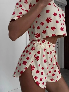 Women's summer pajama set with cute red paw print short sleeve top and elastic shorts