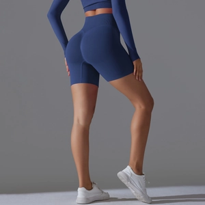 Detail view of seamless dark blue yoga shorts with body-shaping and butt-lift effect