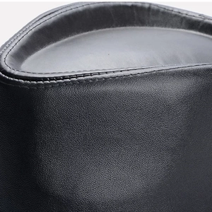 Macro detail of black lychee grain leather fedora hat with double reinforced stitching